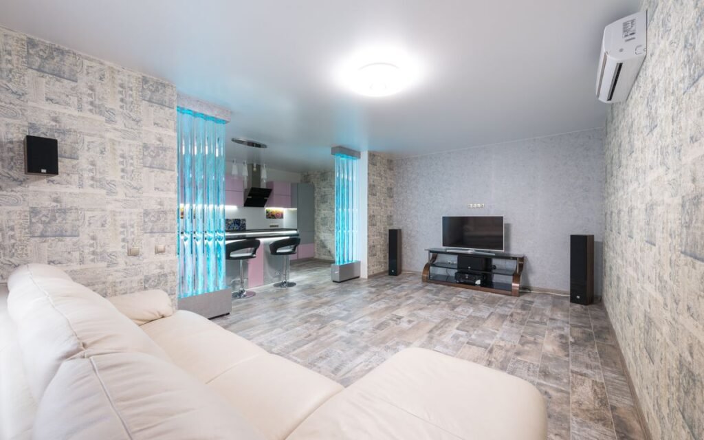 Spacious living room with a sofa and open kitchen