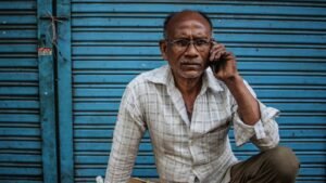 elderly Indian man on a phone call, the kind of user an Airtel voice-only plan is built for