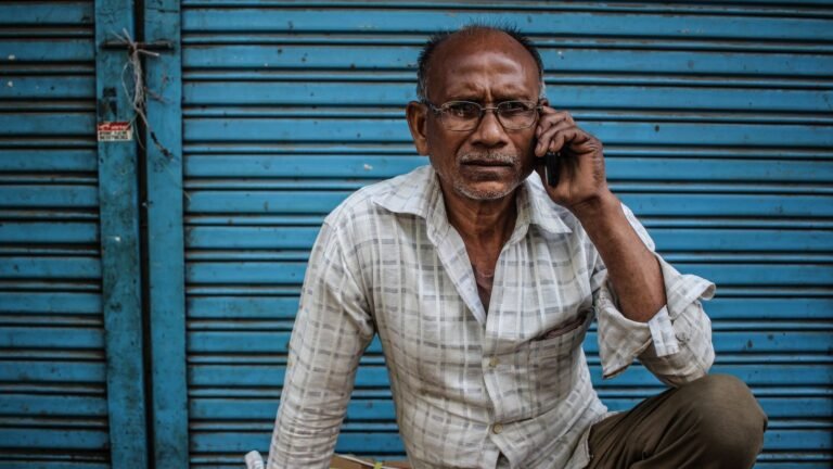 elderly Indian man on a phone call, the kind of user an Airtel voice-only plan is built for