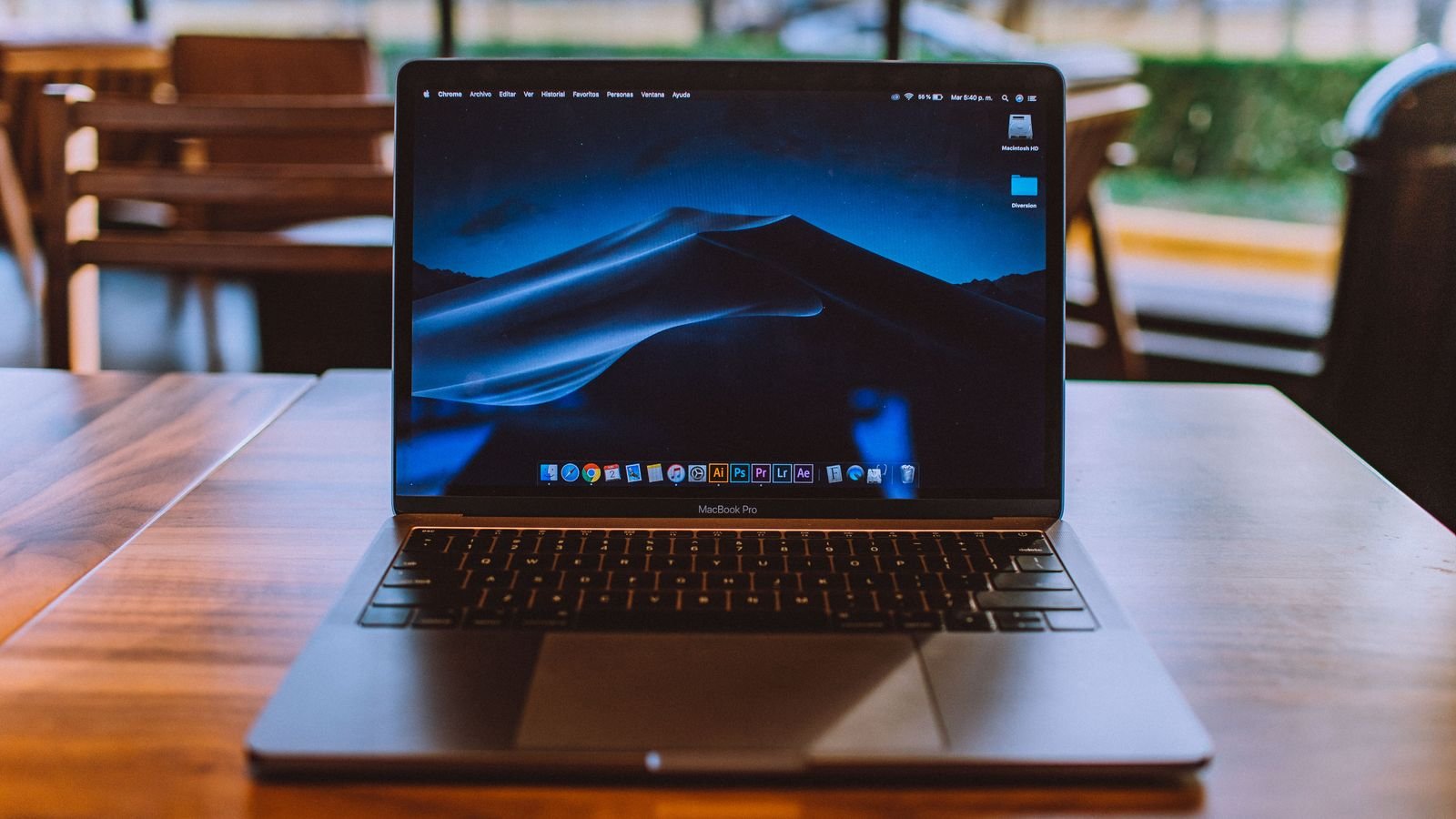 apple october 28 event: MacBook open on a wooden table