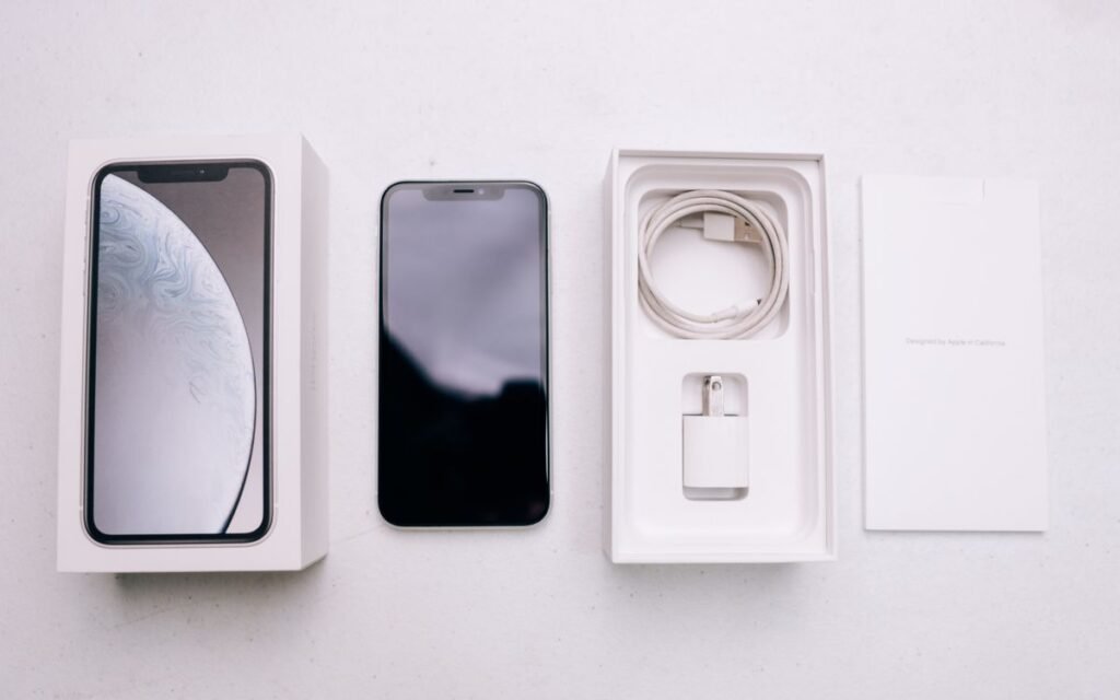 New smartphone laid out with its box and accessories