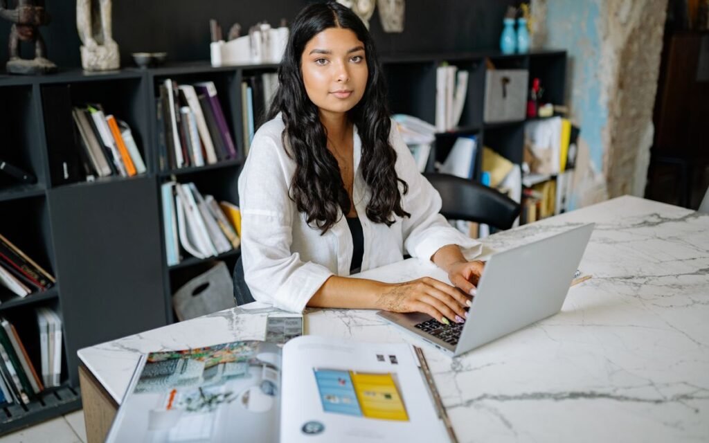 woman working on a laptop at a desk