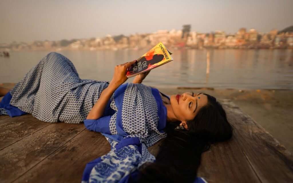 dopamine detox: a woman reading by the river