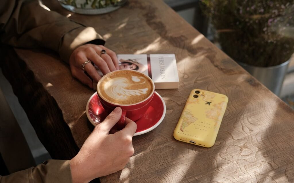 dopamine detox: a coffee, a book and a phone on a table