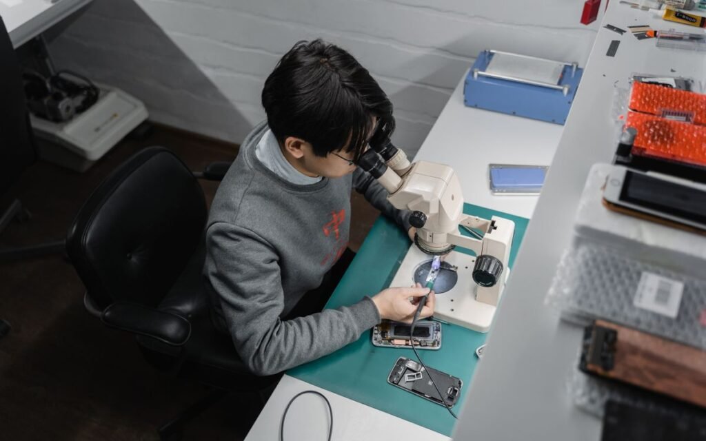extended warranty: a technician repairing a phone