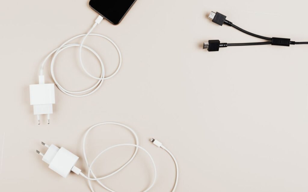 White chargers and cables lying on a table