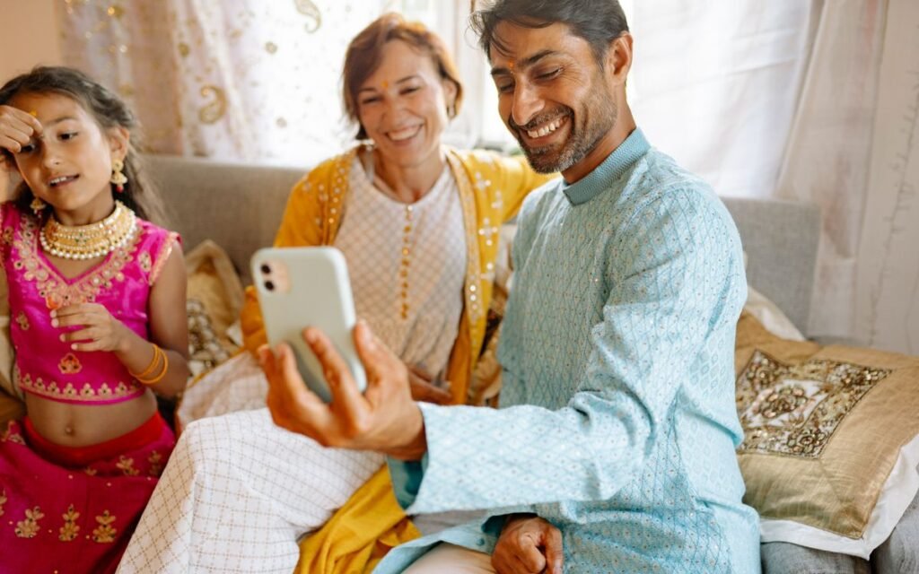A family in festive clothes taking a selfie together at home