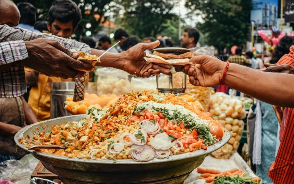 Street vendor serving chaat at a busy market