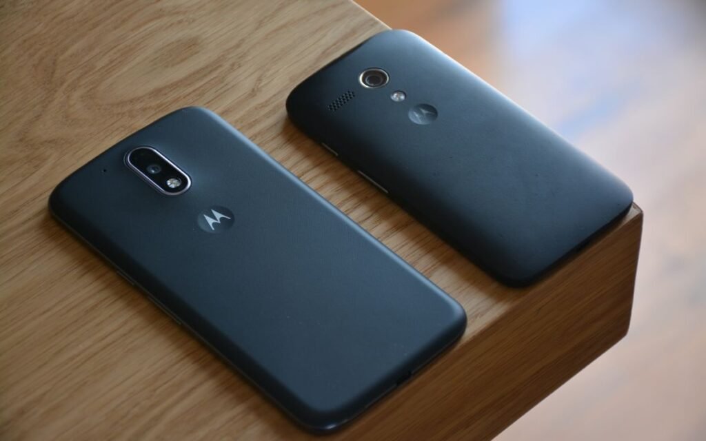 Two smartphones placed side by side on a desk