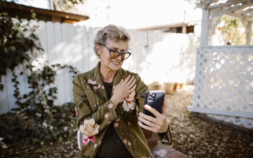 reuse old phone: a senior woman on a video call