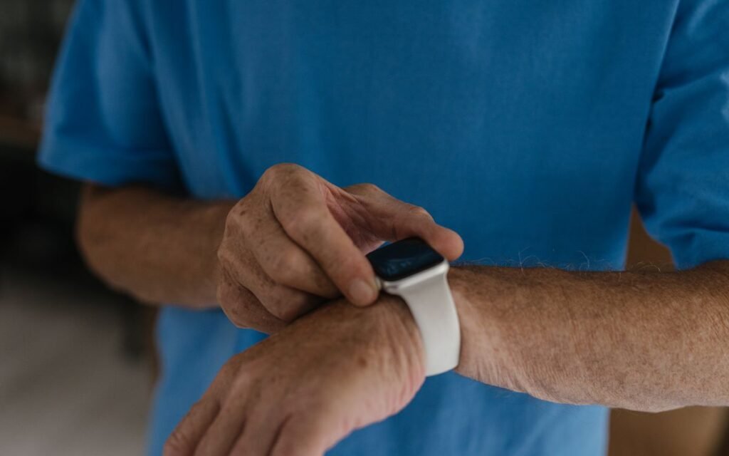 smartwatch hidden features: older man checking his smartwatch