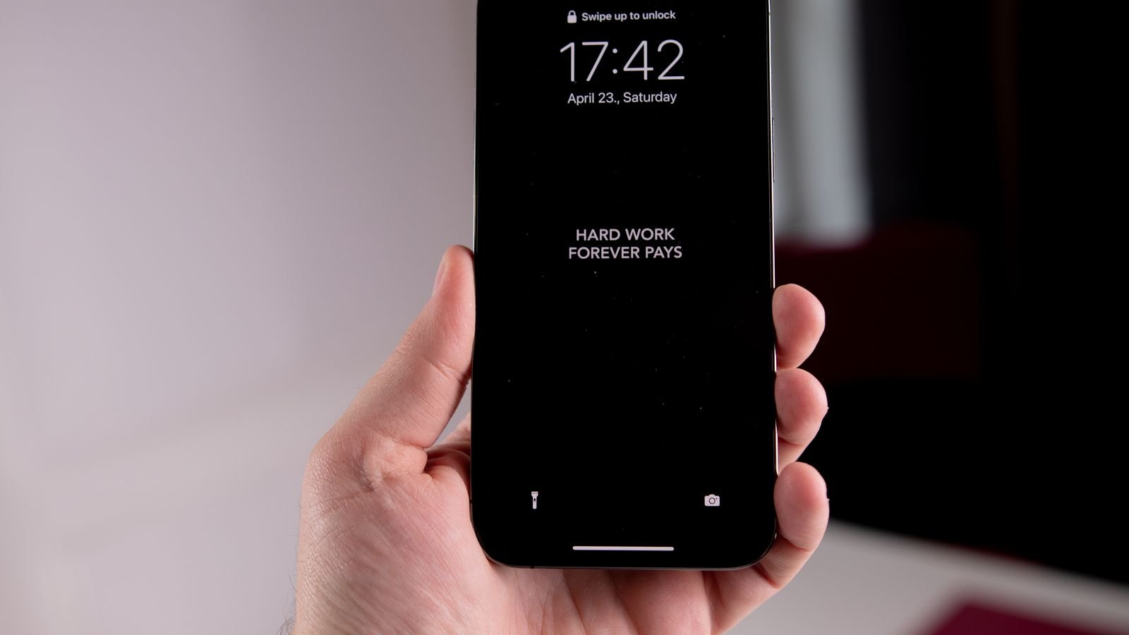 what are passkeys: a hand holding a locked smartphone