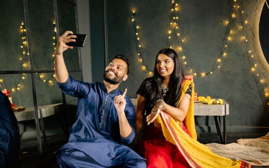a couple in festive clothes taking a selfie